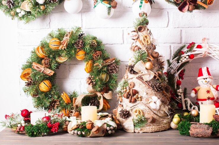 1 christmas decorations including wreaths a tree and a snowman figurine with candles and natural elements