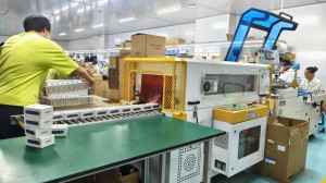 Factory packaging line with workers