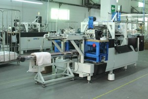 Industrial sewing machine in a factory workshop