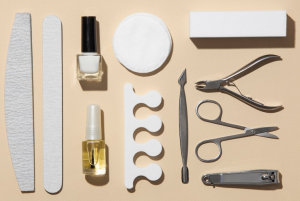 Nail care tools on beige background