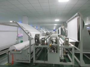Textile machinery in a clean and bright factory workshop
