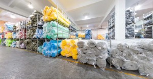 Warehouse with various rolls of fabric neatly stored