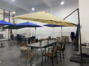 indoor space with various tables chairs and large umbrellas